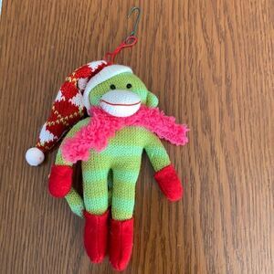Green knit monkey with stocking‎ cap Christmas tree ornament